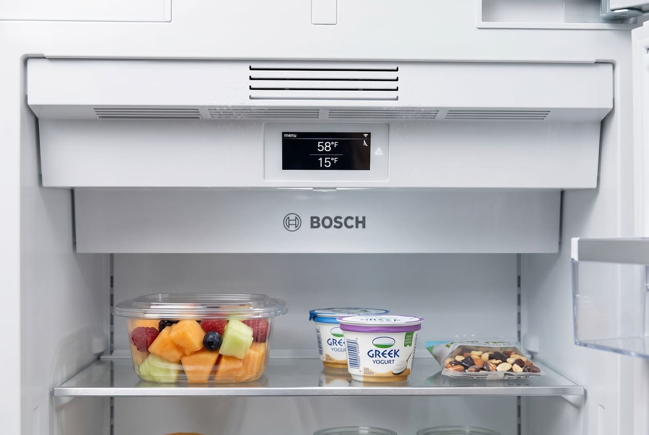 Running fan and active display on Bosch refrigerator that still needs compressor testing