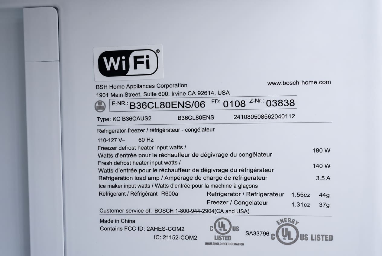 a Bosch refrigerator warranty document or model sticker inside the unit 